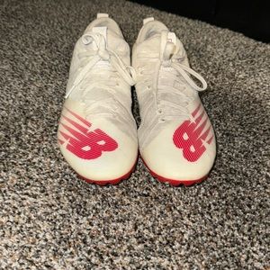 White and red new balance lacrosse cleats